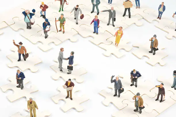 Photo of Social Media Little people on puzzle pieces