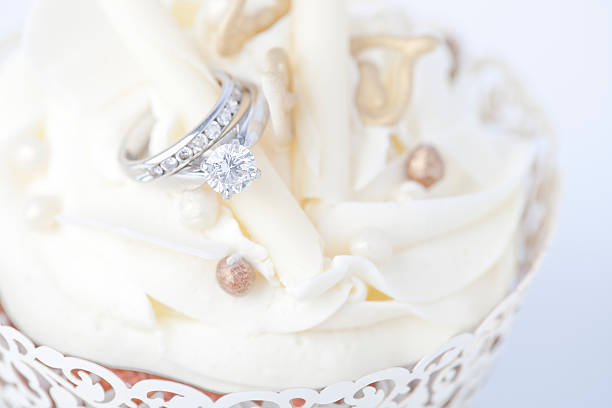 Engagement ring in wedding cupcake wedding cake close up macro stock pictures, royalty-free photos & images
