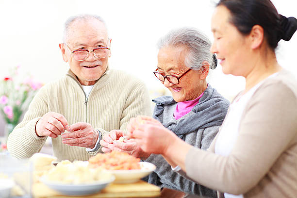 istock happy chinese family prepare dumpling in home 155395448