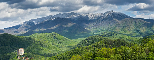 Smoky Mountains Springtime Panorama Snowfall blankets the Smoky Mountains peaks. Panoramic composition. gatlinburg great smoky mountains national park north america tennessee stock pictures, royalty-free photos & images
