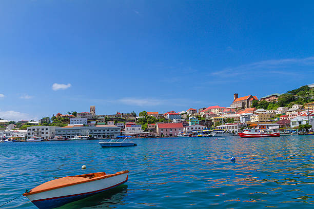 The Carenage is the beautiful waterfront of St. George's, lined with elegant colonial buildings and colorful Caribbean style dwellings, with restaurants, bar and shops. Built by the French in 1650, St. George's, the capital of Grenada, faces a horseshoe-shaped harbor and is surrounded by a hillside of an old volcano crater.