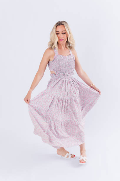 istock Blonde woman in spring dress 1553969384