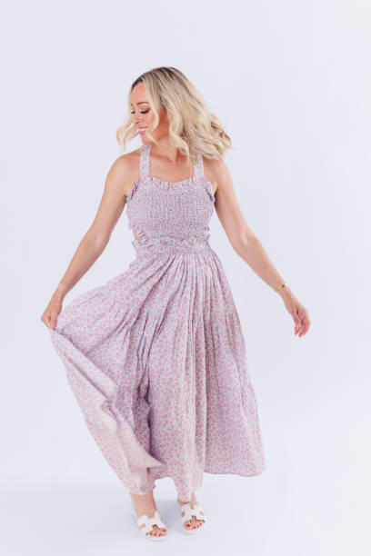istock Blonde woman in spring dress 1553969390