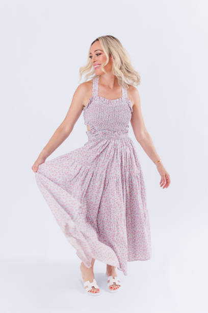 istock Blonde woman in spring dress 1553969391