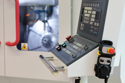 HMI control panel of CNC vertical machining center. Selective focus.