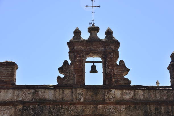 istock Old Building With Bell and Cross 1553979214