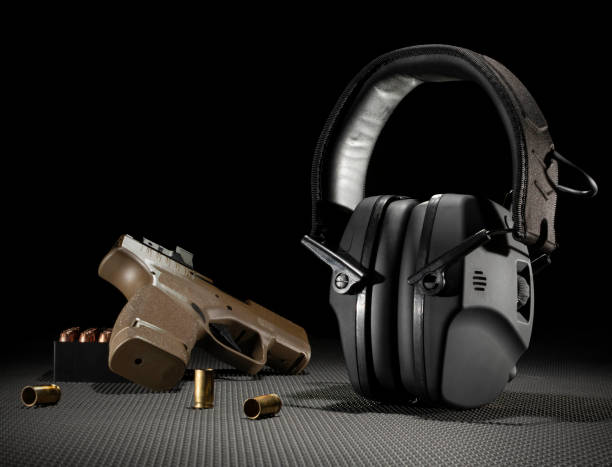 istock 9 mm pistol with ammo and hearing protection 1553994842