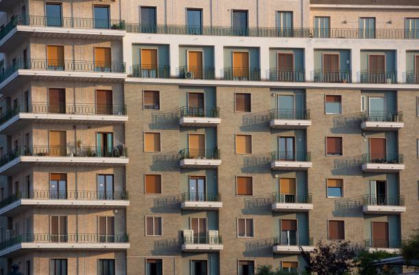 istock Contemporary multi-story apartment building during sunset 1554003945