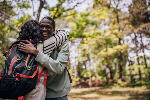 istock Man and woman hugging in nature 1554012623