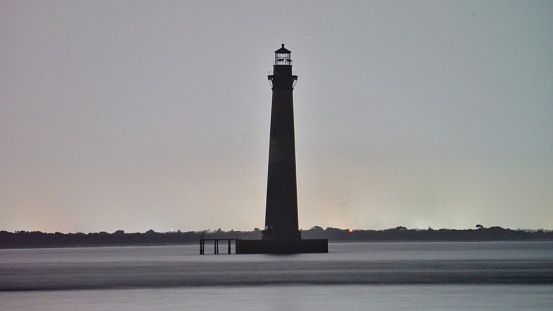 The deactivated Morris island lighthouse at the Charleston harbor,  South Carolina, usa