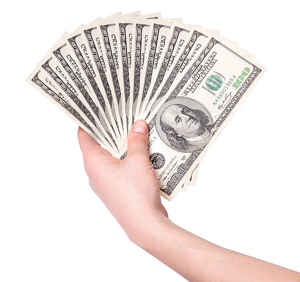 istock female hands with dollars isolated on a white 155402423