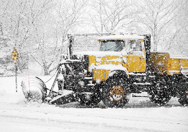 istock Snowplow Clearing road during winter storm 155402604