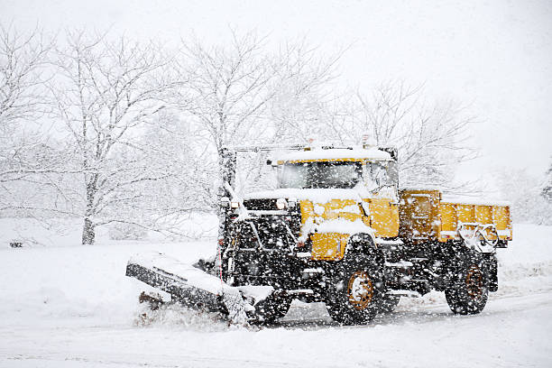 istock Snowplow Clearing Snow During Winter Storm 155402646