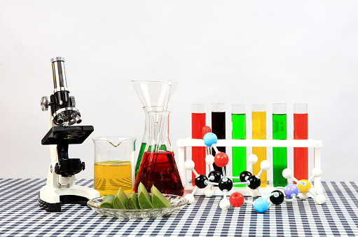 Education Laboratory, Set of glass for trial Science with the test tube, Begerglass, conical flask with the colorful  solution chemical   and microscope on the table in white background