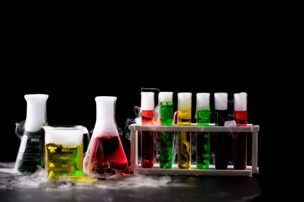 istock Science and Chemical in laboratory concept, laboratory glassware with solution and smoke on black background 1554039495