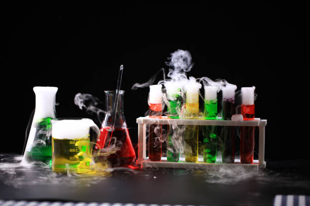 istock Science and Chemical in laboratory concept, laboratory glassware with solution and smoke on black background 1554042593
