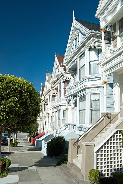 Alamo Square in San Francisco with Victorian houses Victorian houses painted ladies in San Francisco near Alamo Square transamerica pyramid san francisco stock pictures, royalty-free photos & images