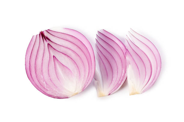 istock Pieces of red onion on white background 1554067409