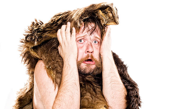 Caveman in bear skin studio shot