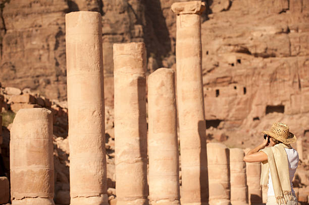 istock woman traveller at ruin. 155411737