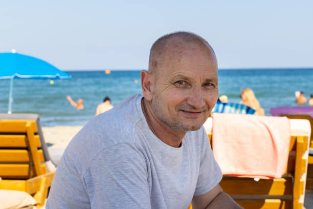 One smiling man enjoying the fresh sea breeze at the resort