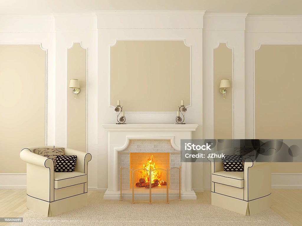 Armchairs near the fireplace Classic interior in beige tones, the central part of which has a fireplace Fireplace Stock Photo