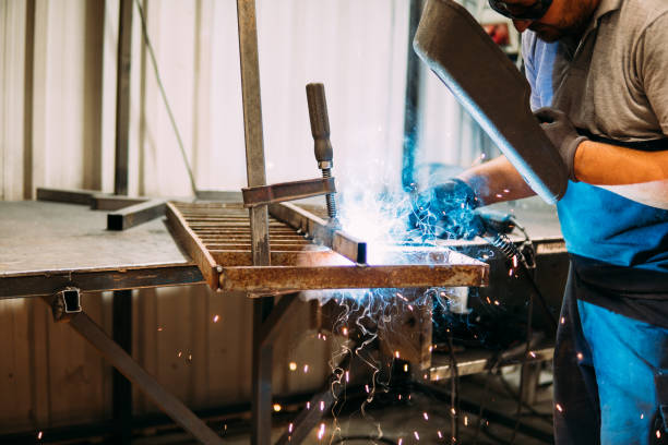 istock Worker welding the iron stock photo 1554146894