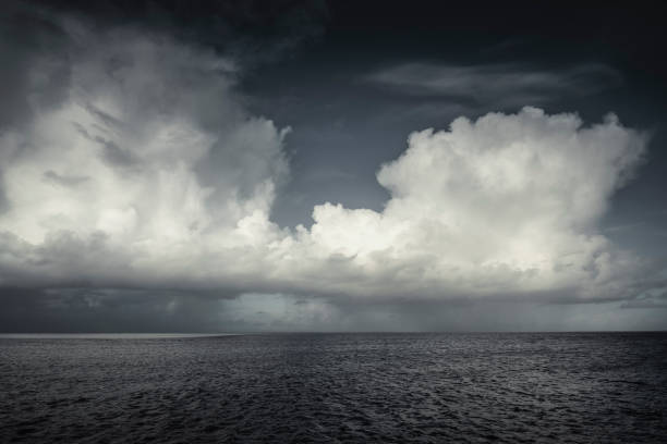 Massive Cumulus clouds are rising over the Andaman sea, Thailand.  With it comes a Summer tropical storm with torrential rain which occurs during monsoon season.