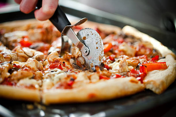 Homemade Pizza Buy similar: pizza cutter stock pictures, royalty-free photos & images