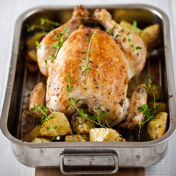 Sumptuous roasted chicken with herbs and potatoes 