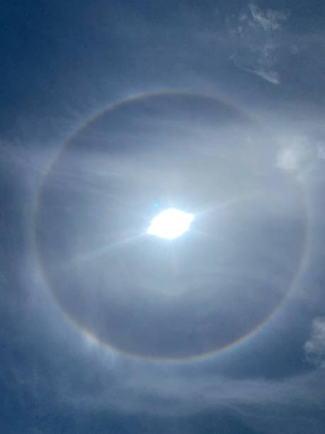 istock A halo  is an optical phenomenon produced by light (sun) interacting with ice crystals suspended in the atmosphere. 1554158004