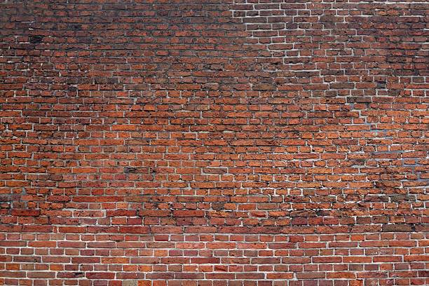 istock Aged Brick and Mortar Exterior Wall Background Wallpaper 155415958