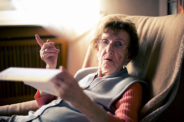 istock Senior woman reading a letter 155416313
