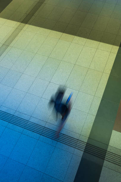 istock top view of people walking down a corridor 1554166512