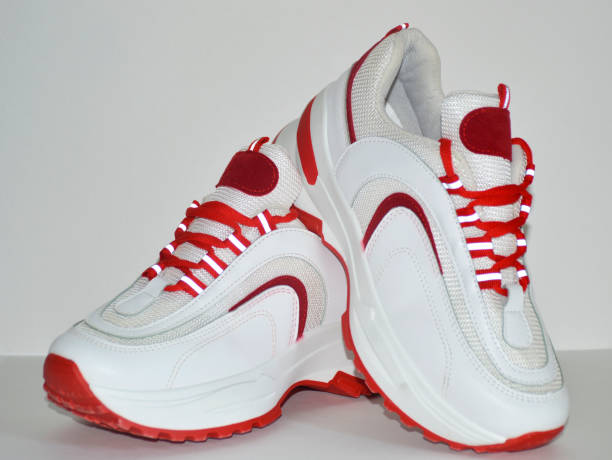 istock women's sneakers in red and white on a white background 1554172222