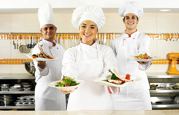 istock Chefs Holding Plates of Food 155417377