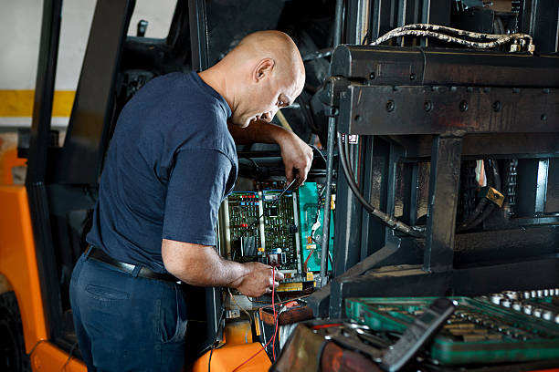 Mechanic Working  forklift photos stock pictures, royalty-free photos & images