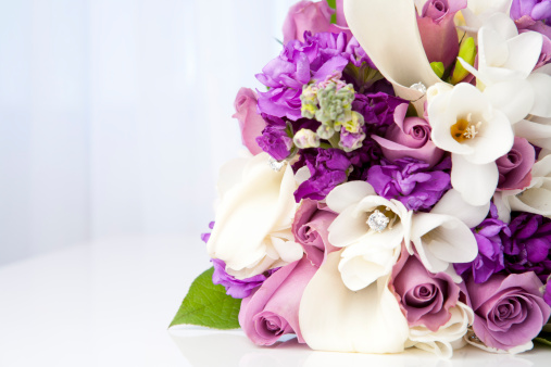 Beautiful wedding bouquet with white and pink roses, closeup. Floral background and texture.