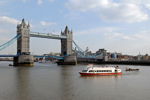 The stock photo shows the iconic historic London landmark Tower Bridge which is located in the City of London, England, United Kingdom, Great Britain. Captured on a sunny and bright day in July, in the summer of 2023. The Tower Bridge in London on a beautiful summer day, England, United Kingdom. An iconic landmark. An engineering marvel. A symbol of London. Tower Bridge is indeed all of that, but also a muse, a source of inspiration to many artists.