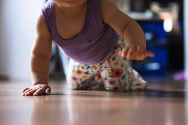 istock Close-up of a baby crawling 1554177544