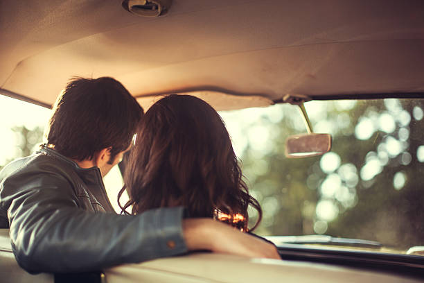 istock Car Vintage Interior Couple Rear View 155417821