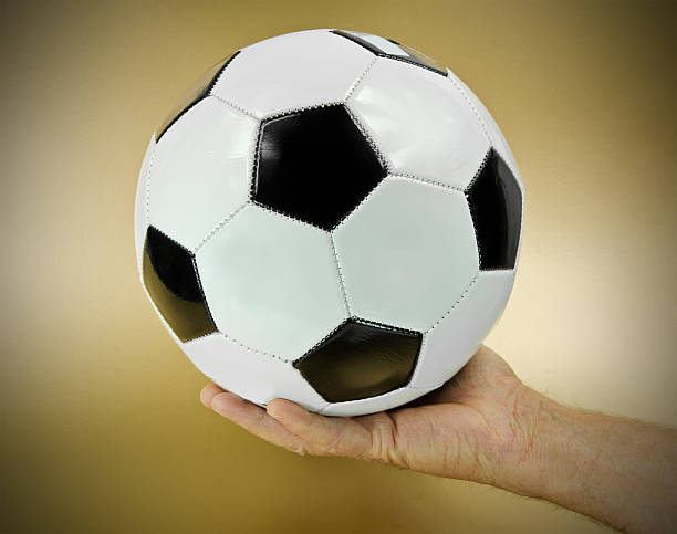 istock Football Held in Hand 155417822