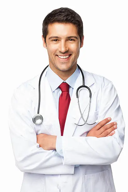 Portrait of a happy male doctor in lab coat standing with arms crossed. Vertical shot. Isolated on white.
