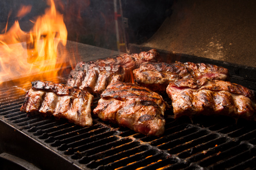 Raw ribeye steak on cutting board. Barbecue cooking
