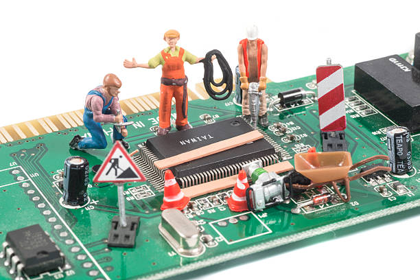 istock repairing computer equipment with figurines 155418262