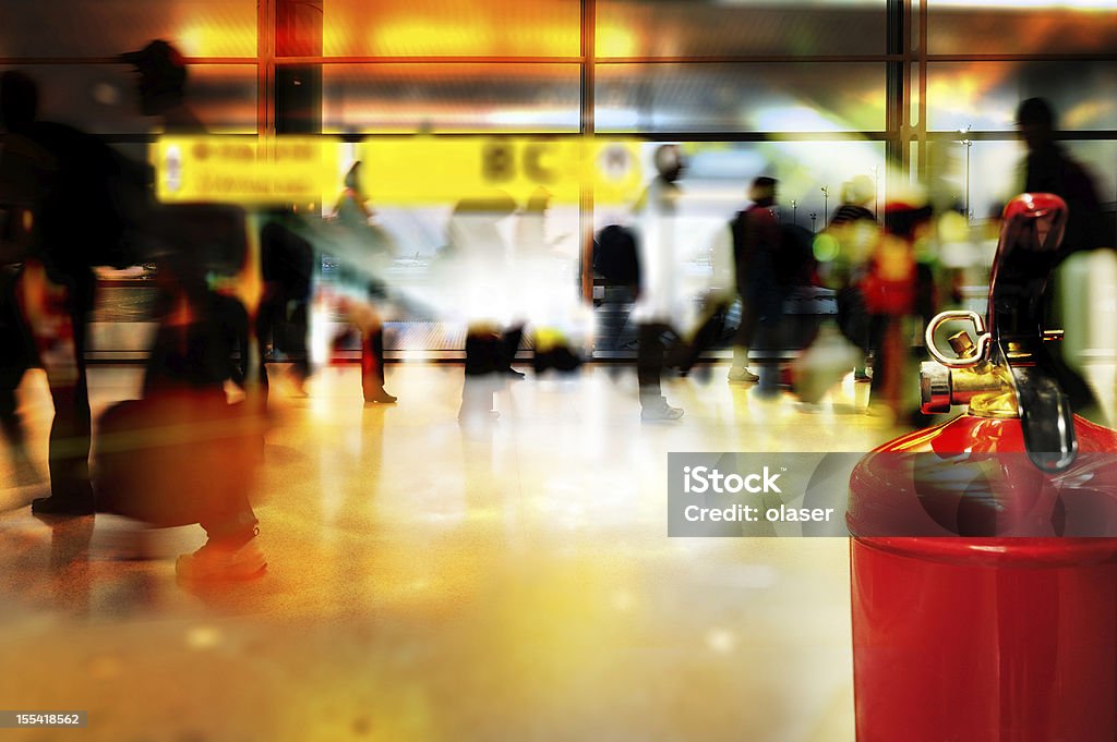 Fire extinguisher in airport terminal building Close up of fire extinguisher in public transportation building / station. Fire - Natural Phenomenon Stock Photo