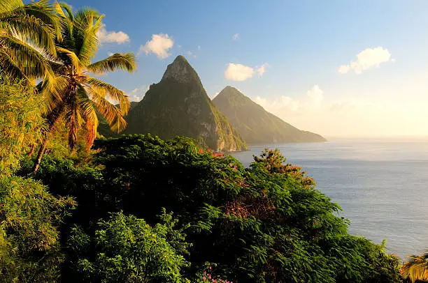 Photo of St. Lucia's Twin Pitons lit by sunset glow