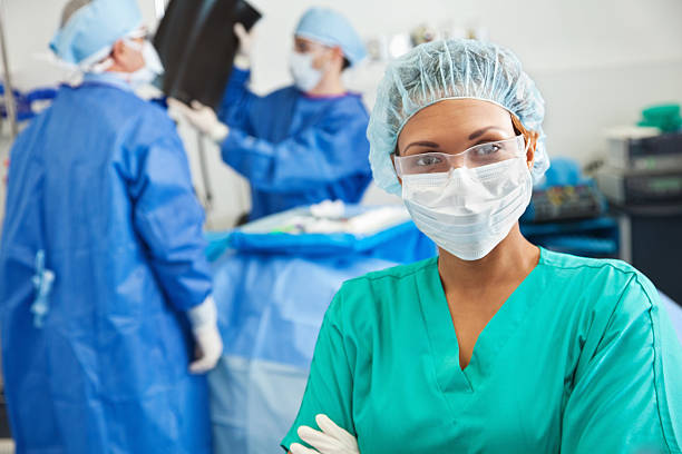 Serious surgeon in hospital operating room Serious surgeon in hospital operating room.  operating room photos stock pictures, royalty-free photos & images