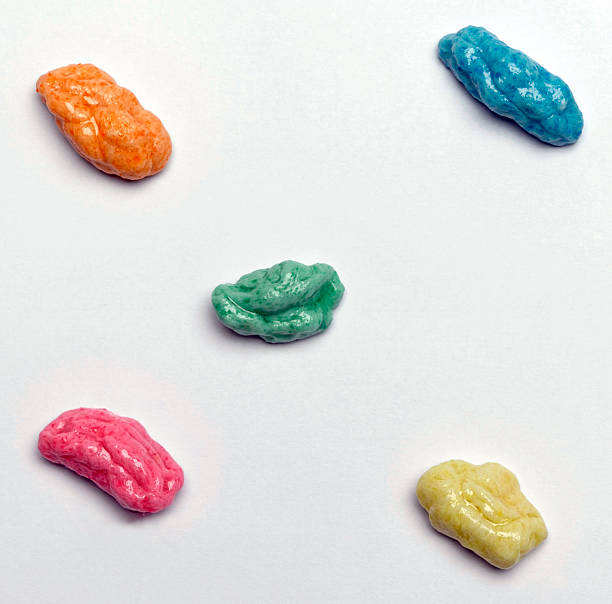 Chewed Gum Different colored chewed up gum for design use chewed stock pictures, royalty-free photos & images