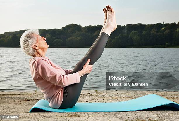 Senior Woman Exercising Outdoors Stock Photo - Download Image Now - Senior Adult, Yoga, Senior Women